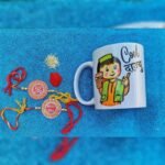 Aipan Art Rakhi Combo With Dajyu Mug