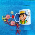 Aipan Art Rakhi Combo With Bhula Mug